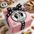 DALL·E 2024-11-05 20.07.55 - A pink gift box sized approximately 3 inches wide and 6 inches long with a black ribbon featuring white paw prints, positioned so that the ribbon does